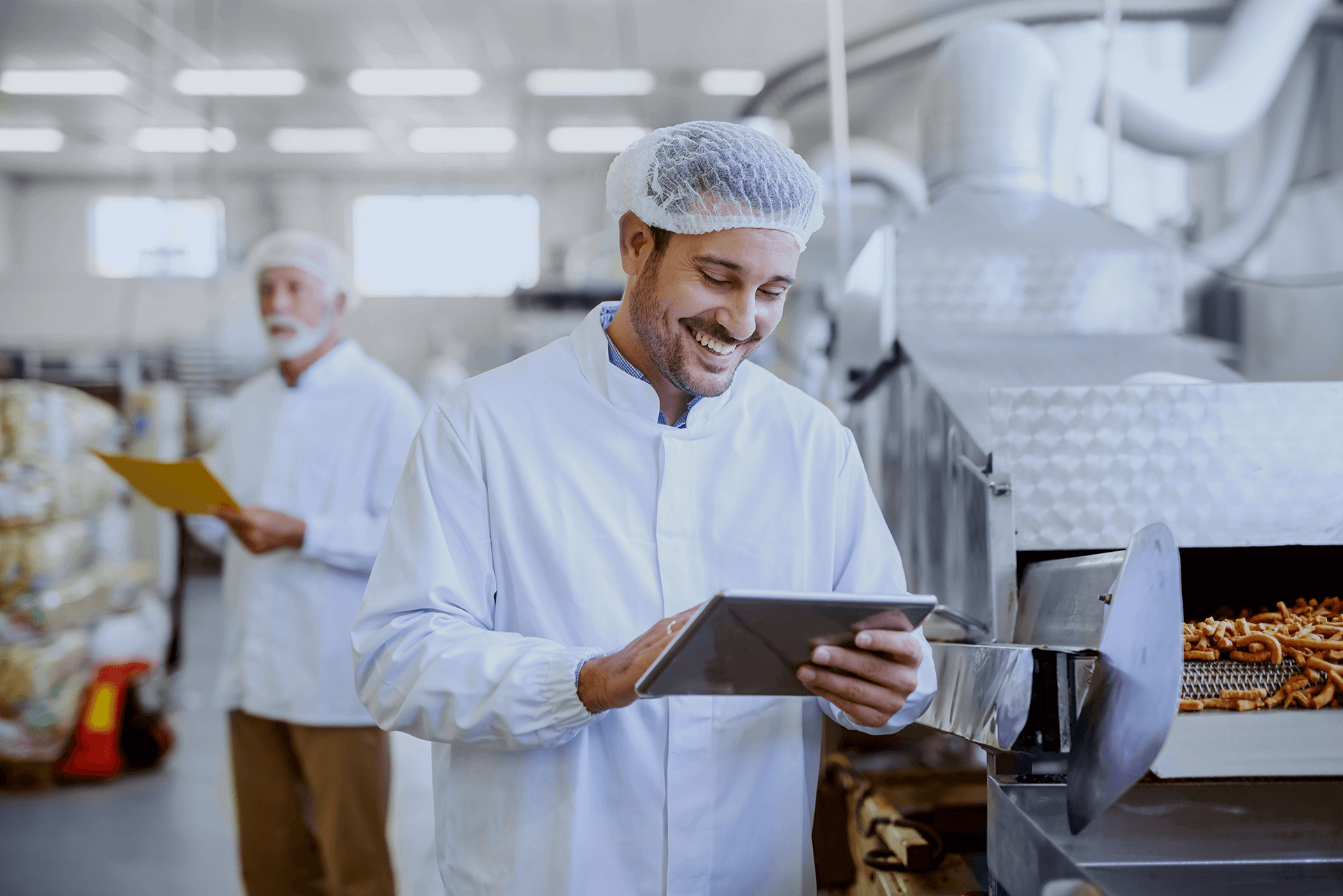 Worker in the Food Processing Industry Wearing Hair Net and Smiling