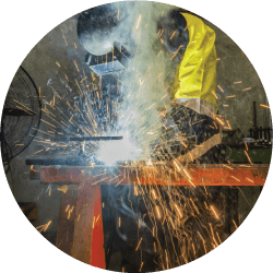 man welding in a manufacturing facility