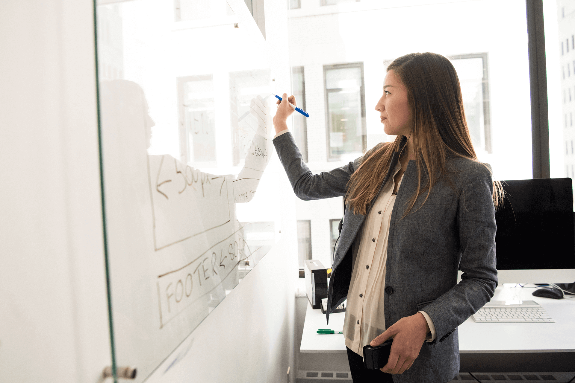 University Student Drawing on Whiteboard